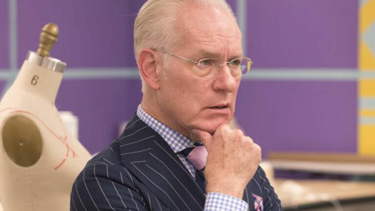 Tim Gunn, resting his chin in his hand and looking puzzled, on Project Runway