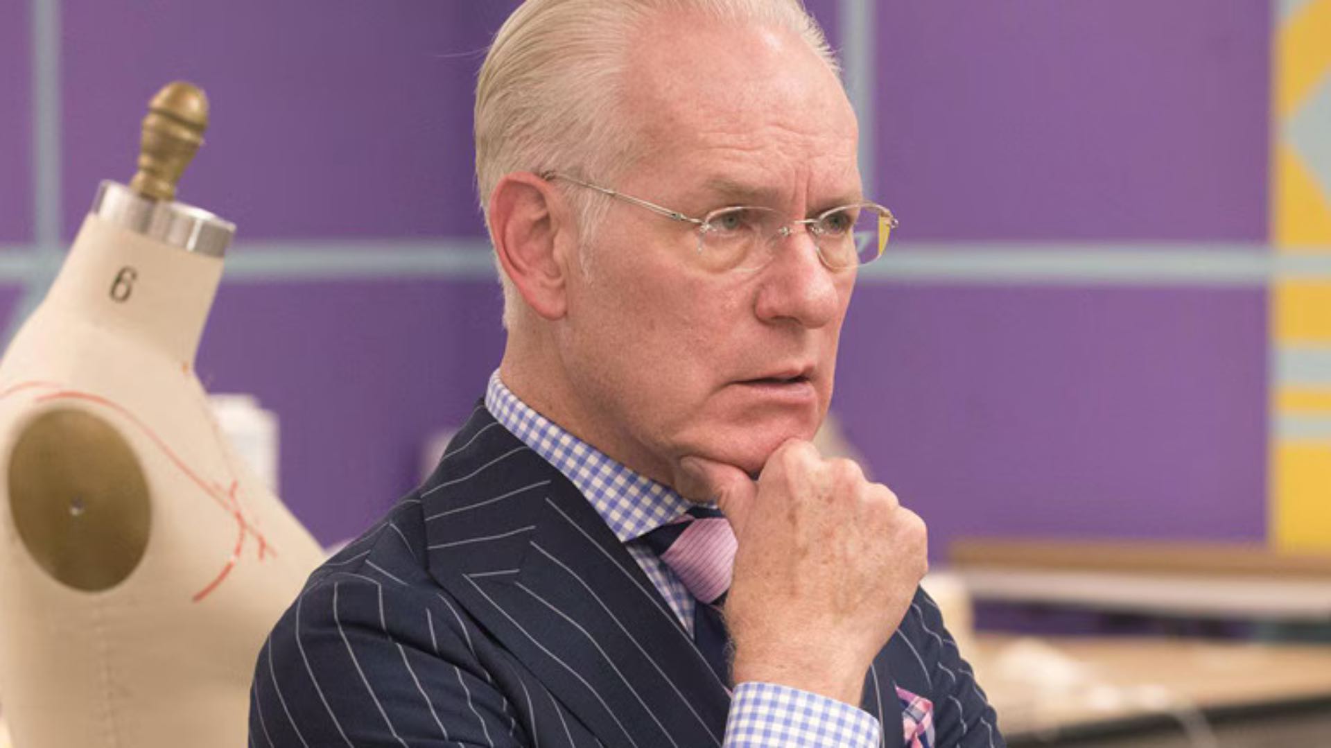 Tim Gunn, resting his chin in his hand and looking puzzled, on Project Runway