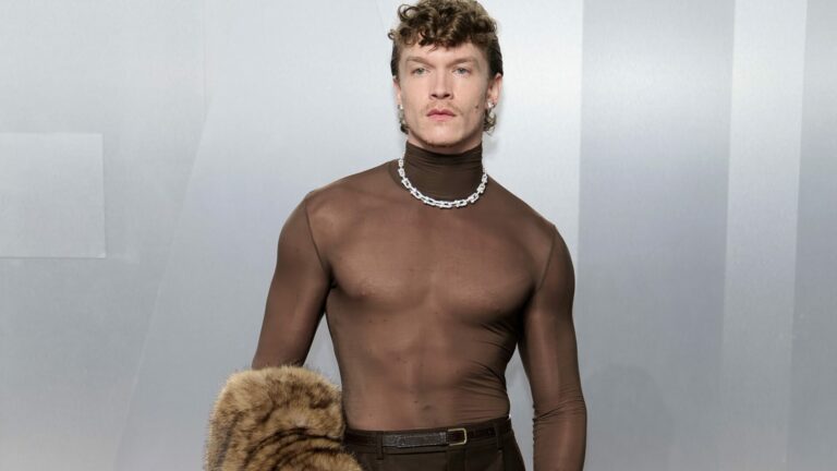 Heated Rivalry star Connor Storrie attends the 2026 Vanity Fair Oscar Party wearing Saint Laurent