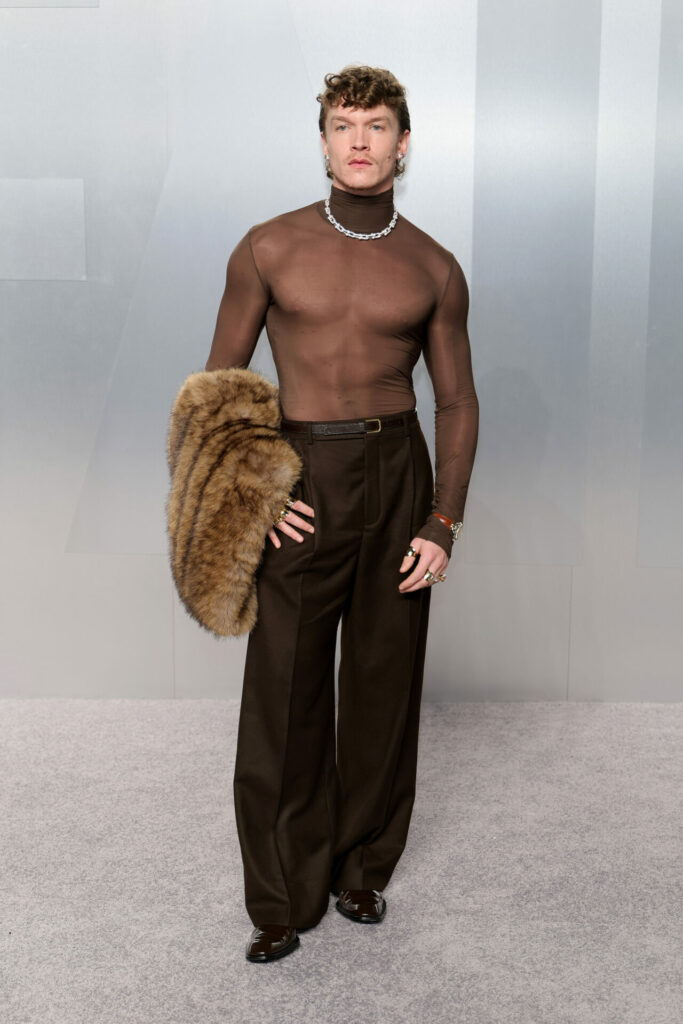 Heated Rivalry star Connor Storrie attends the 2026 Vanity Fair Oscar Party wearing Saint Laurent