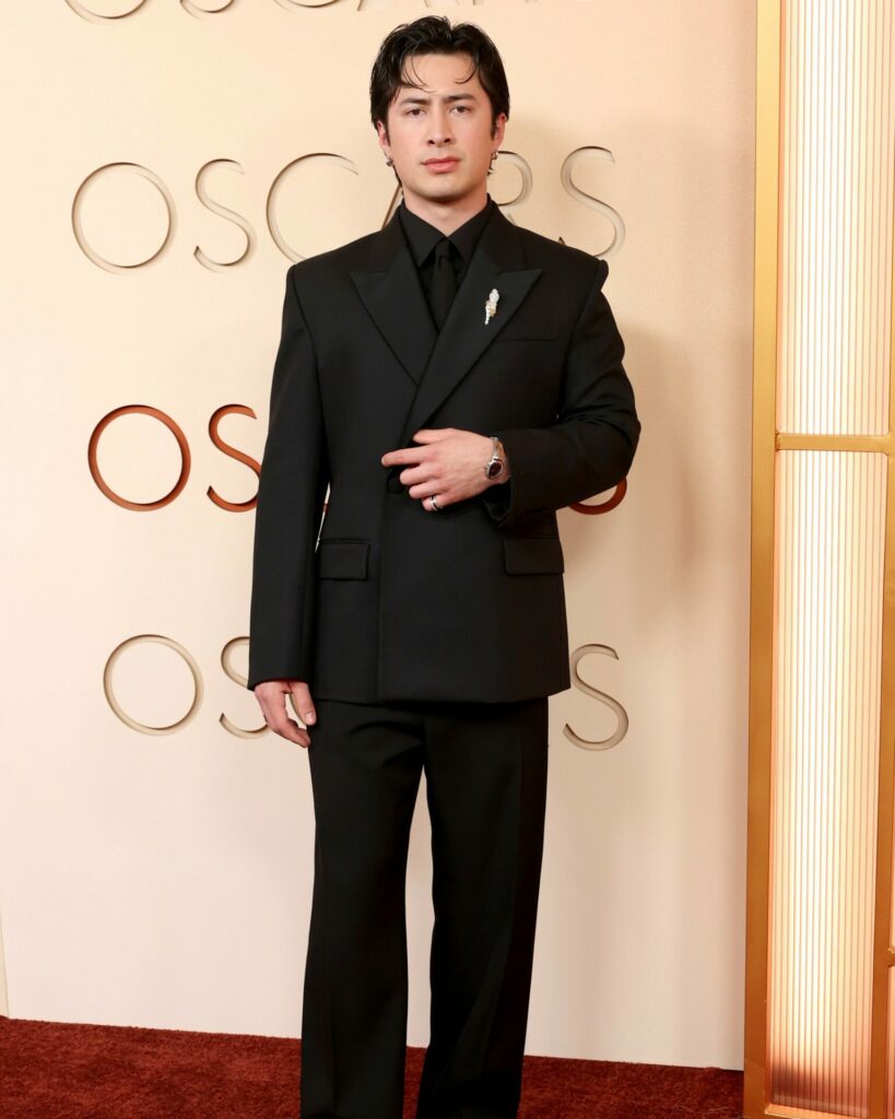 Heated Rivalry star Hudson Williams attends the 2026 Vanity Fair Oscar Party wearing Saint Laurent