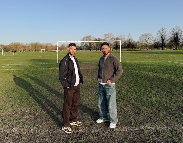 John Reavey and Joe Revens on a football pitch