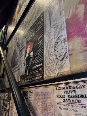Posters on the stairwell at the Black Cap