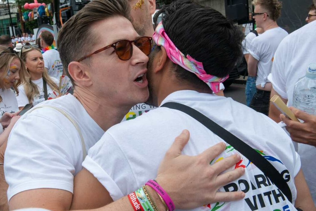 James Longman and Dr Ranj Singh hugging in the 2026 Pride in London parade