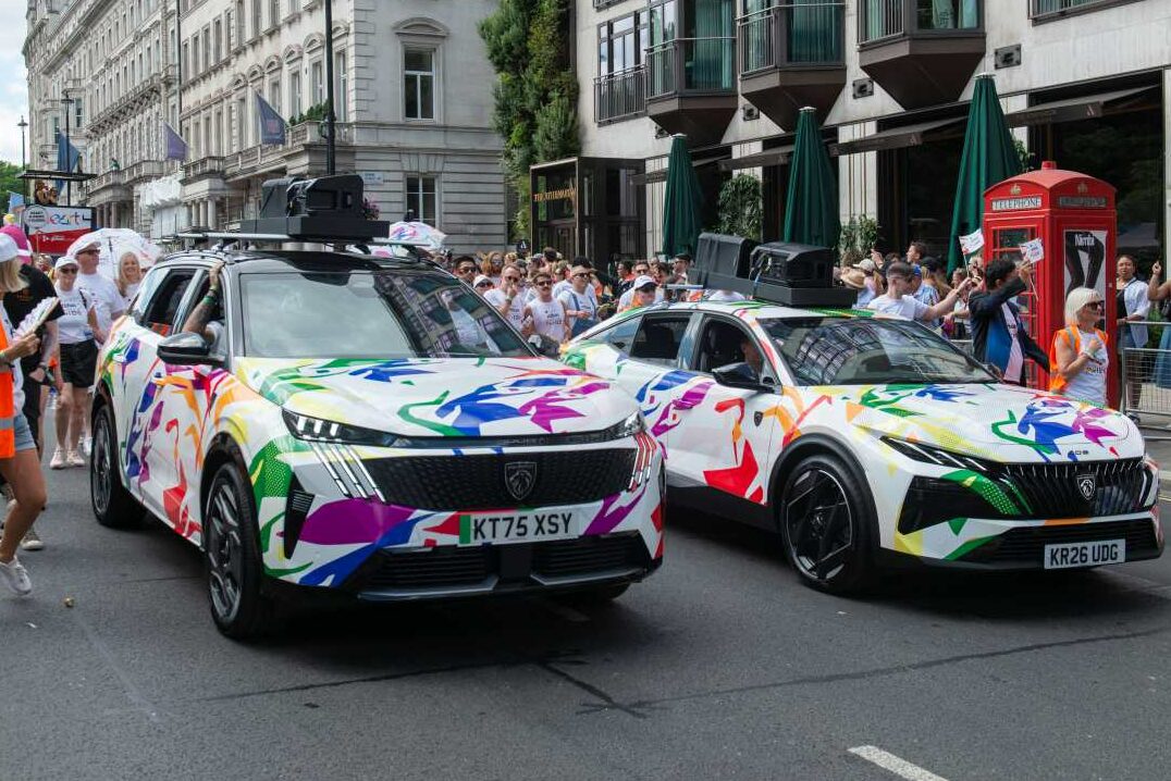 Peugeot e-5008 and New 408 with colourful Pride-themed wraps driving in the Pride in London 2026 parade.