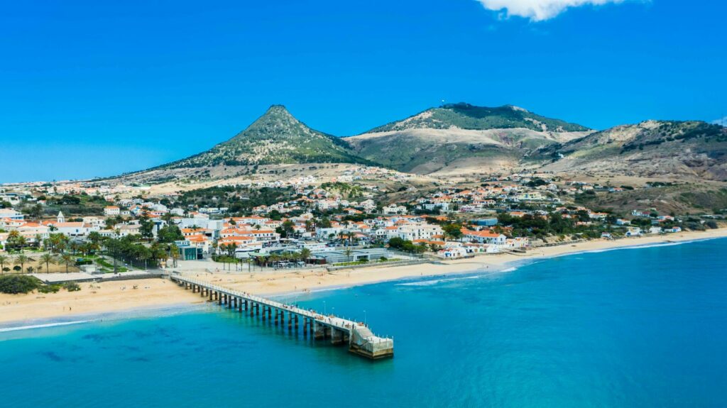 Porto Santo sea front with a long pier jetting out into the ocean