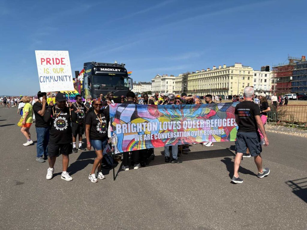 People walking in the parade at Brighton Pride