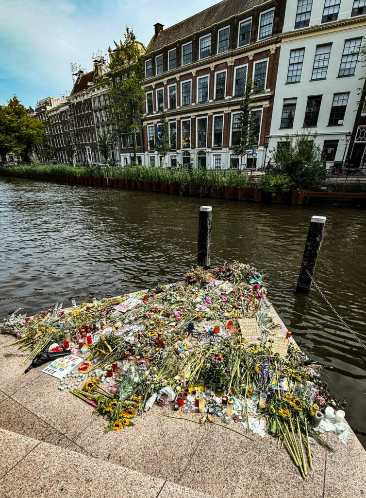 Homomonument with bouquets of flowers on it during WorldPride Amsterdam