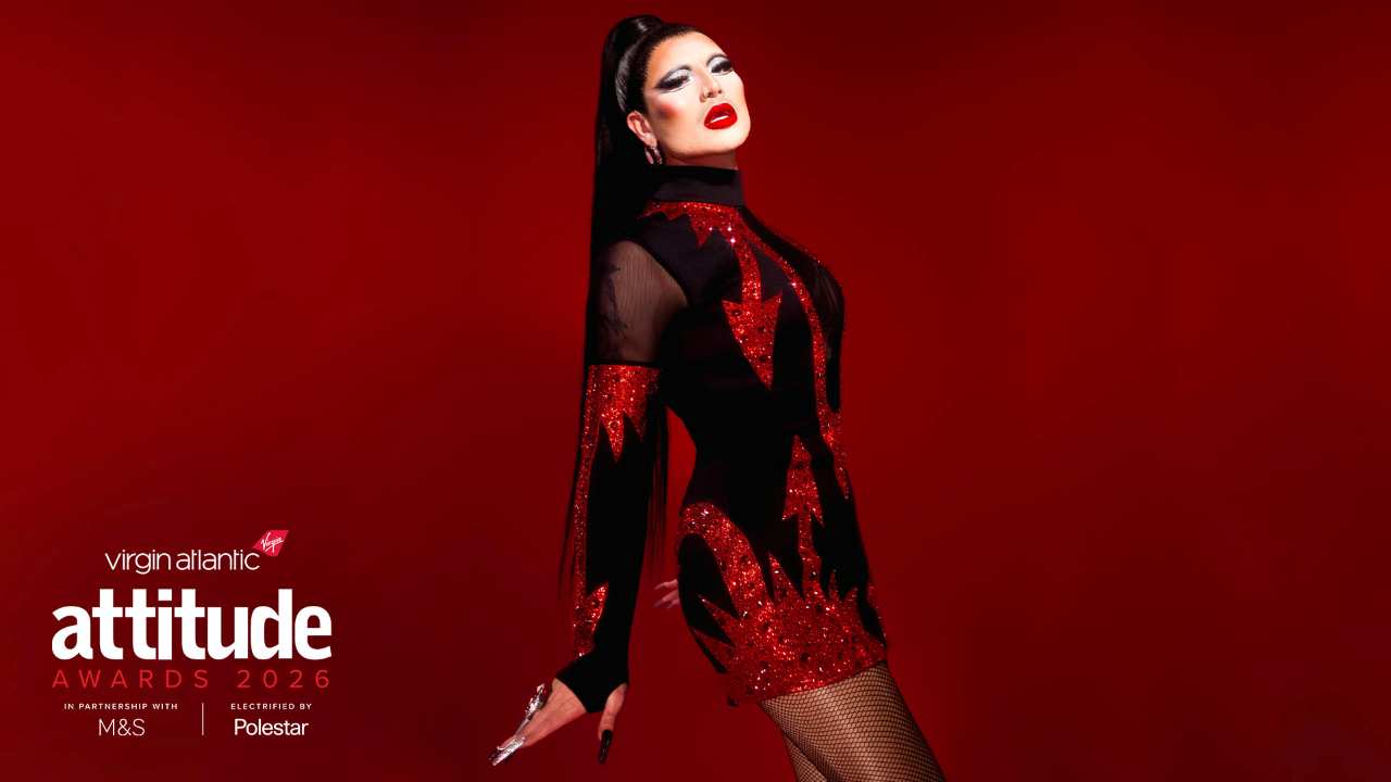 Danny Beard in a red and black dress