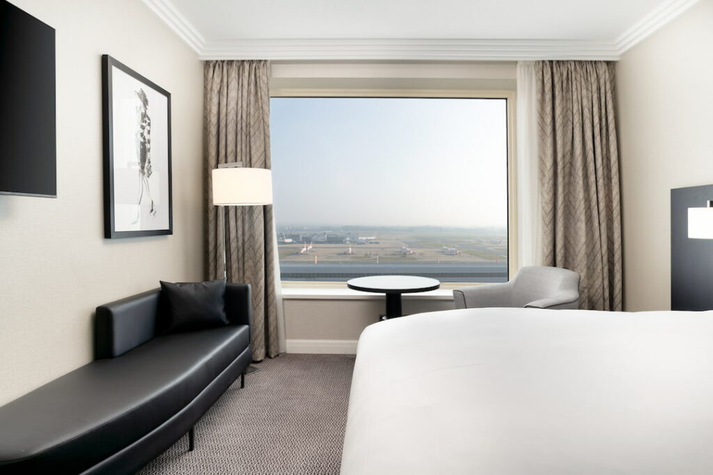 A Superior bedroom with a runway view at the Sofitel Gatwick
