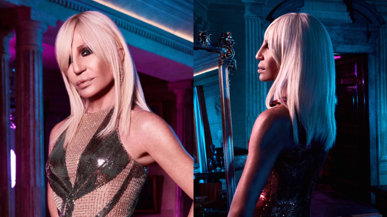 Donatella Versace poses in a ballroom